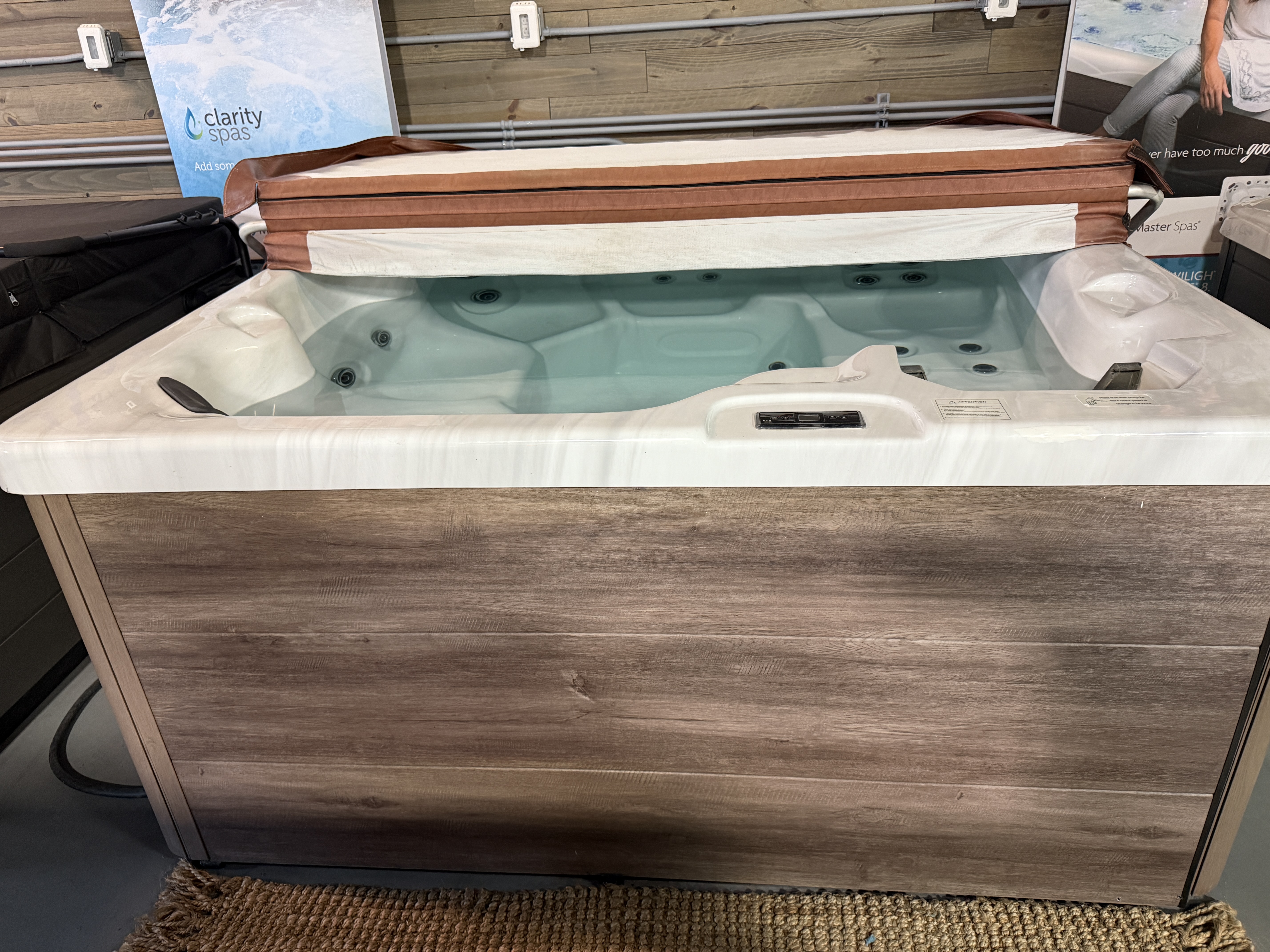 Used 2022 Jetstream hot tub with cover lift on the showroom floor